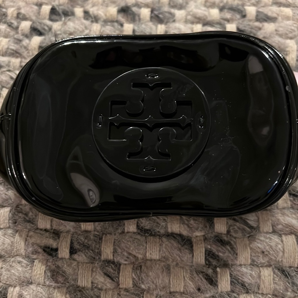 Small black leather tori orchards bag for make up of small bag for money.